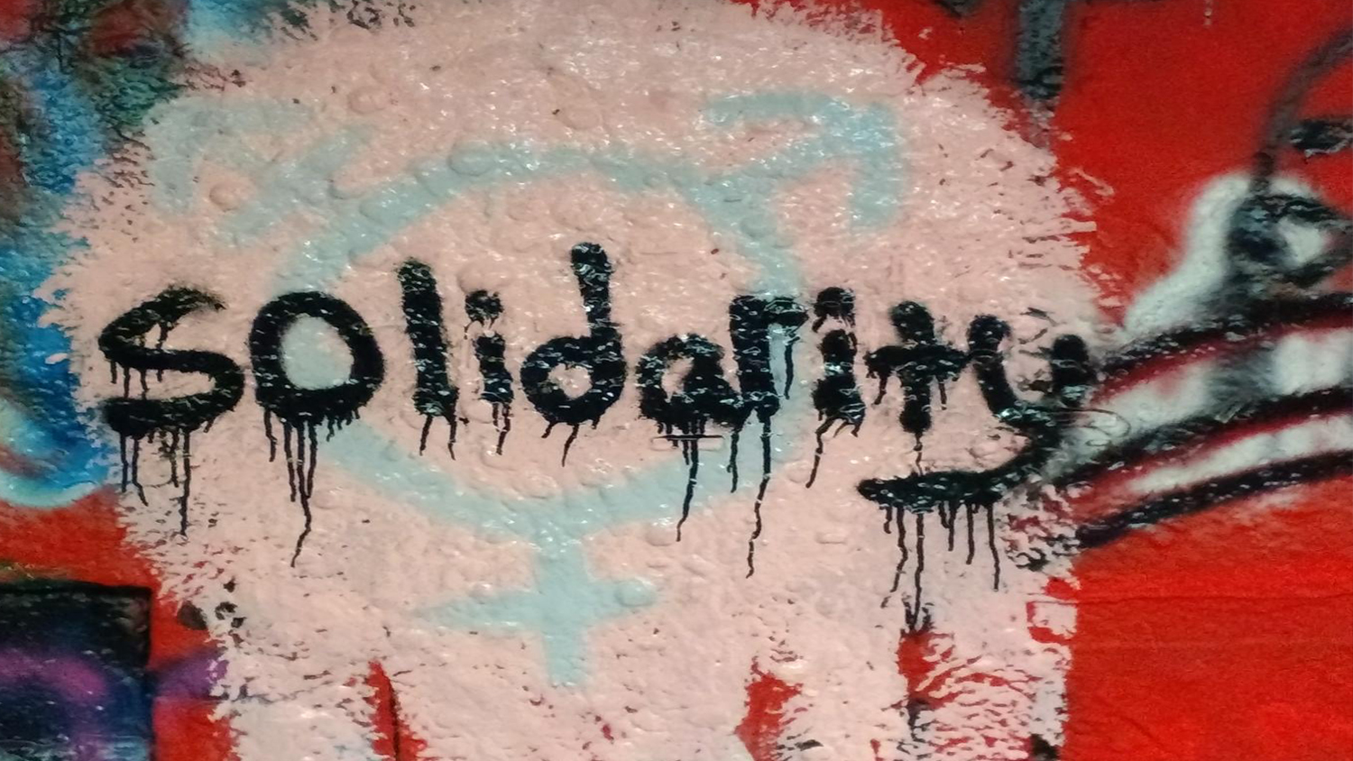 The word "Solidarity" in spray paint in the Free Expression Tunnel
