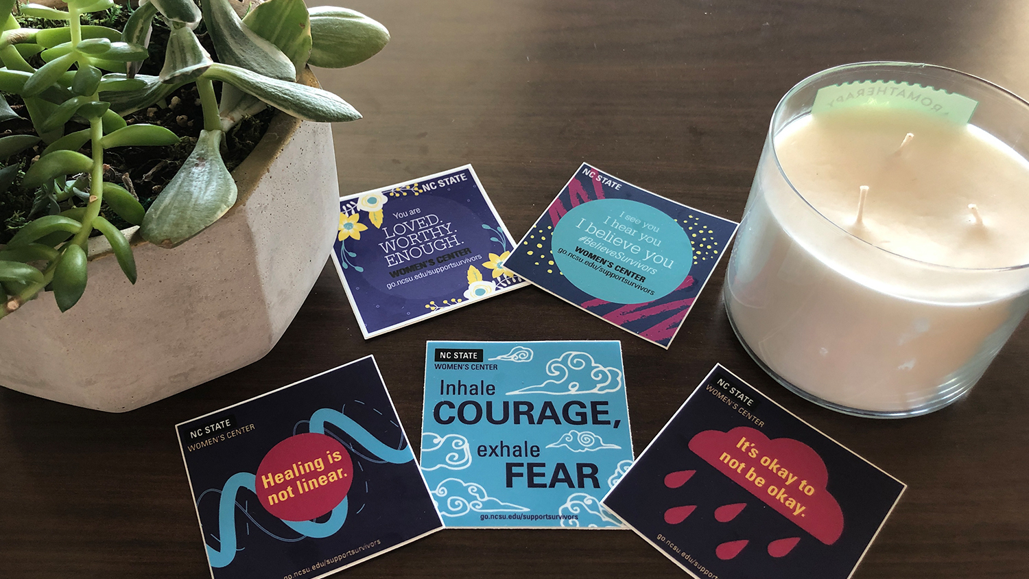 Display of empowering stickers from the Women's Center