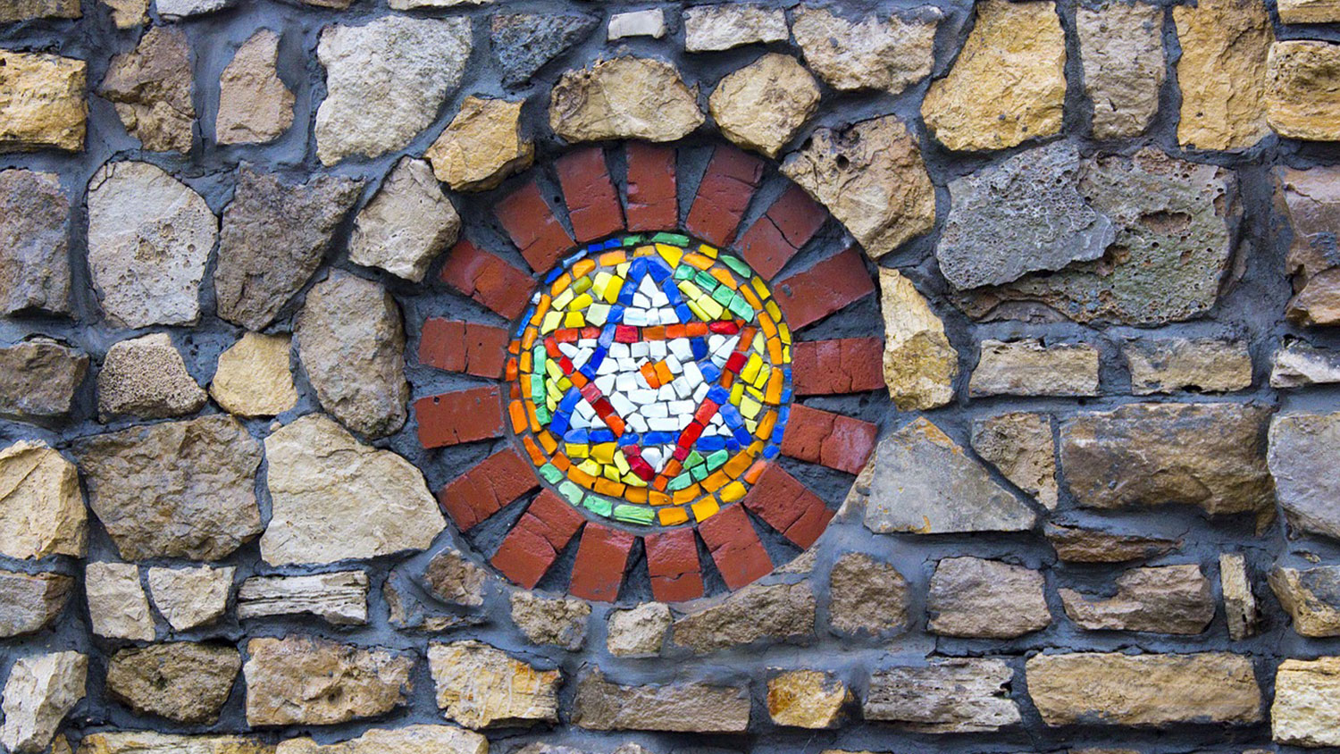 Star of David in mosaic within a stone wall